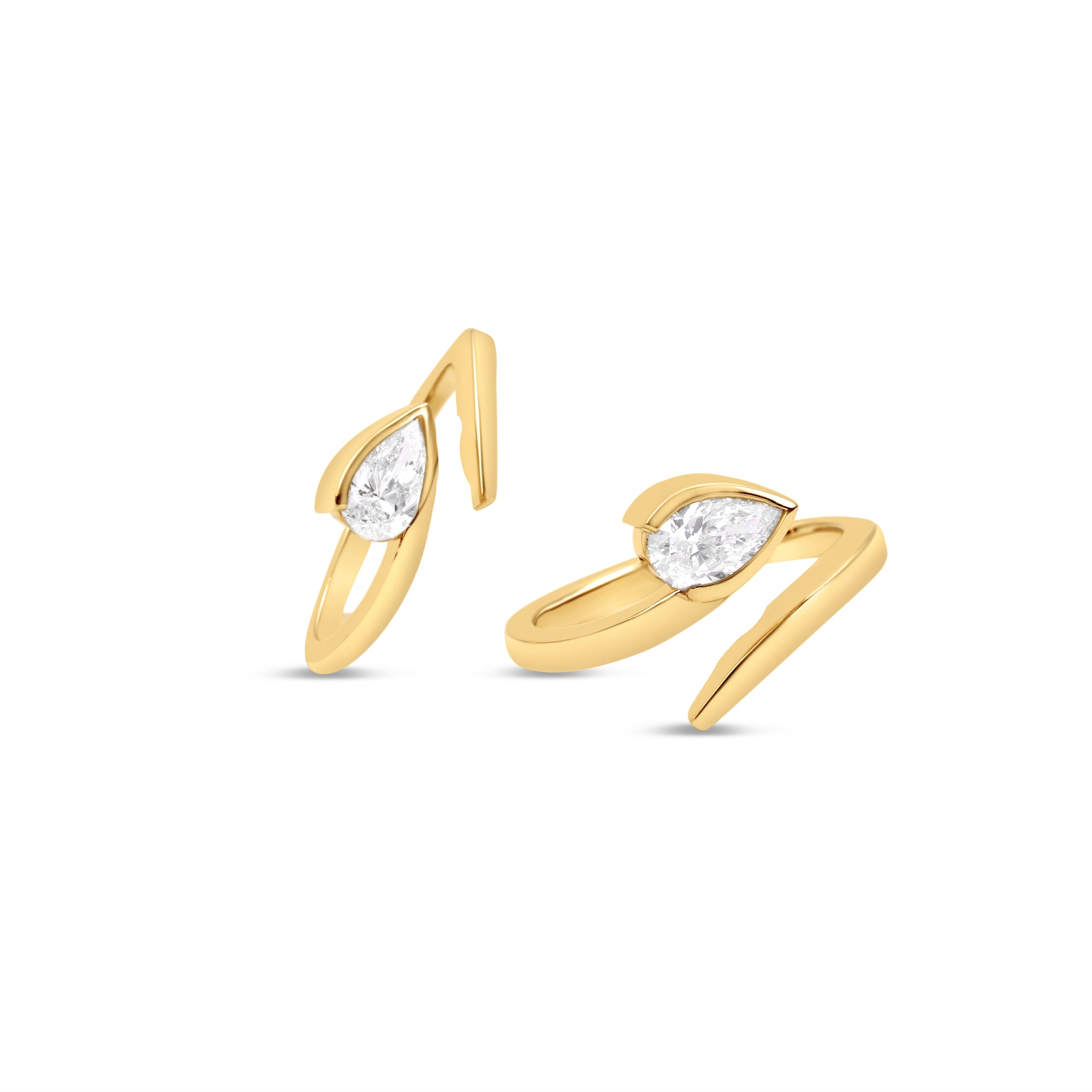 Elegant 14K yellow gold bypass ring featuring a radiant pear-cut diamond, offering a sleek and contemporary design that blends timeless sophistication with a modern edge. Two rings