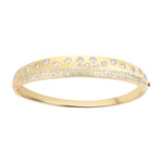 Elegant 14K yellow gold tapered bangle bracelet featuring 1.1ct of scattered diamonds, combining a sleek silhouette with timeless sparkle.