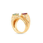 Elegant mother and child ring in 14K yellow gold, featuring a refreshing mint tourmaline paired with a vibrant rubellite, accentuated by a sparkling diamond spray for a meaningful, timeless design. Side View close up