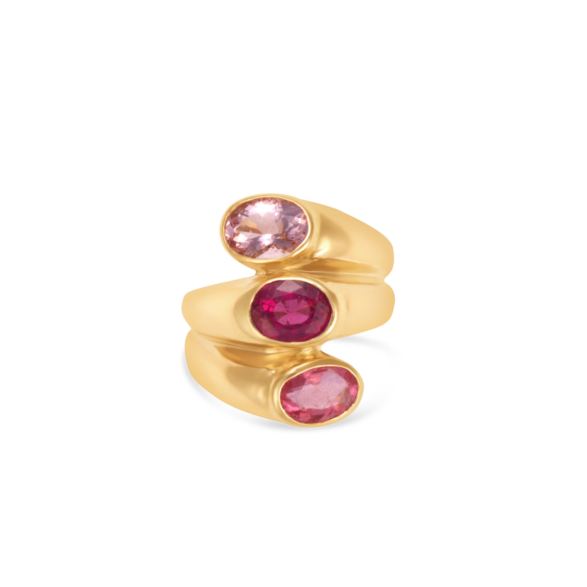Unique 14K yellow gold statement ring featuring three bezel-set tourmaline stones in delicate shades of pink, blending elegance with bold color for a timeless look. Close up. 