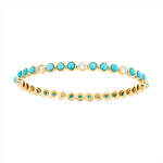 Elegant 14K yellow gold bangle featuring 3.78ct of vivid turquoise and 1.186ct of sparkling diamonds. Sized at 6cm, this gemstone bracelet offers a refined pop of color and shine.