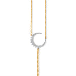Elegant celestial drop necklace crafted in 14K two-tone gold, featuring radiant diamonds that shimmer with every angle, blending modern style with timeless sophistication. Close up of Moon