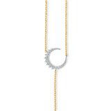Elegant celestial drop necklace crafted in 14K two-tone gold, featuring radiant diamonds that shimmer with every angle, blending modern style with timeless sophistication. Close up of Moon