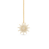 Elegant celestial drop necklace crafted in 14K two-tone gold, featuring radiant diamonds that shimmer with every angle, blending modern style with timeless sophistication. Close up of Sun