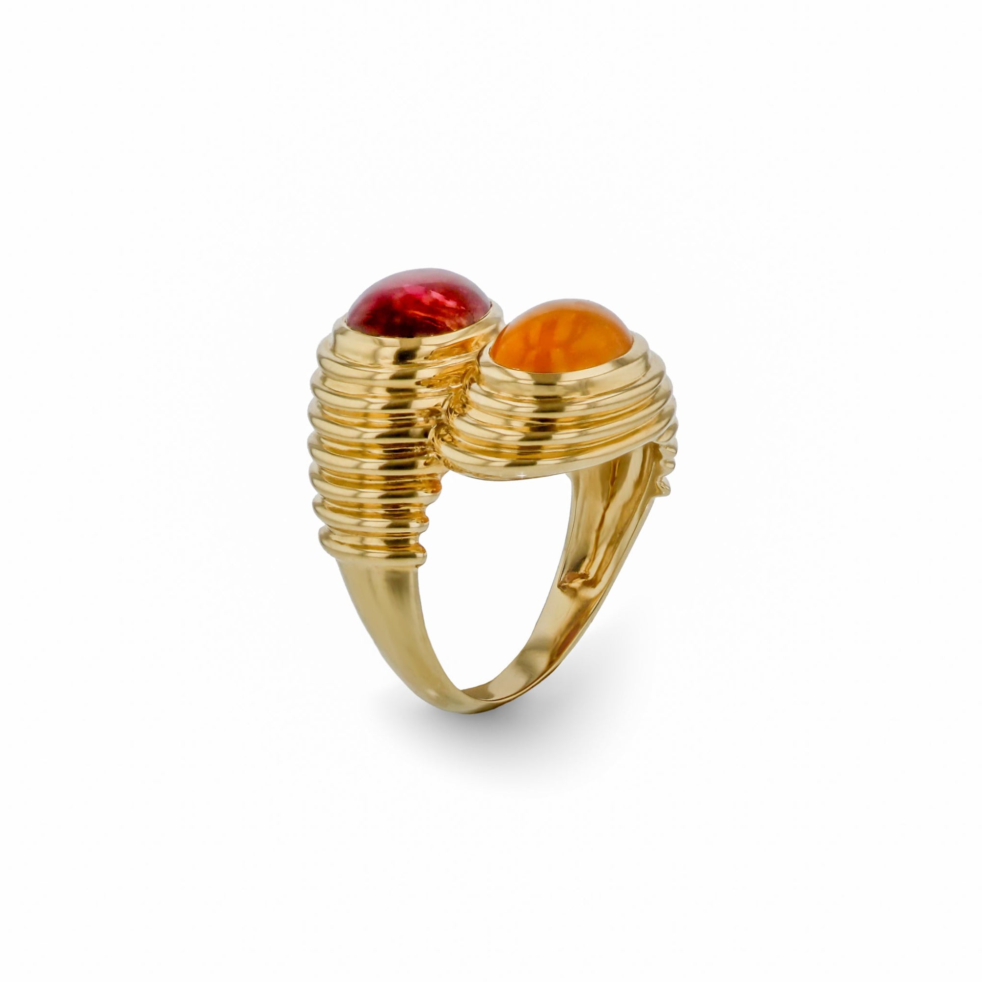 Striking 14K yellow gold bypass ring featuring vibrant orange spessartite and pink tourmaline cabochons, set in a fluted band for a bold and opulent statement. Side angle. 