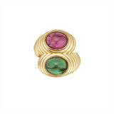 Bold 14K yellow gold bypass ring featuring vibrant 2.75ct pink and green cabochon-cut tourmalines, set in a ribbed design with sculptural elevation—measuring 27.5mm high and weighing 12.05g.