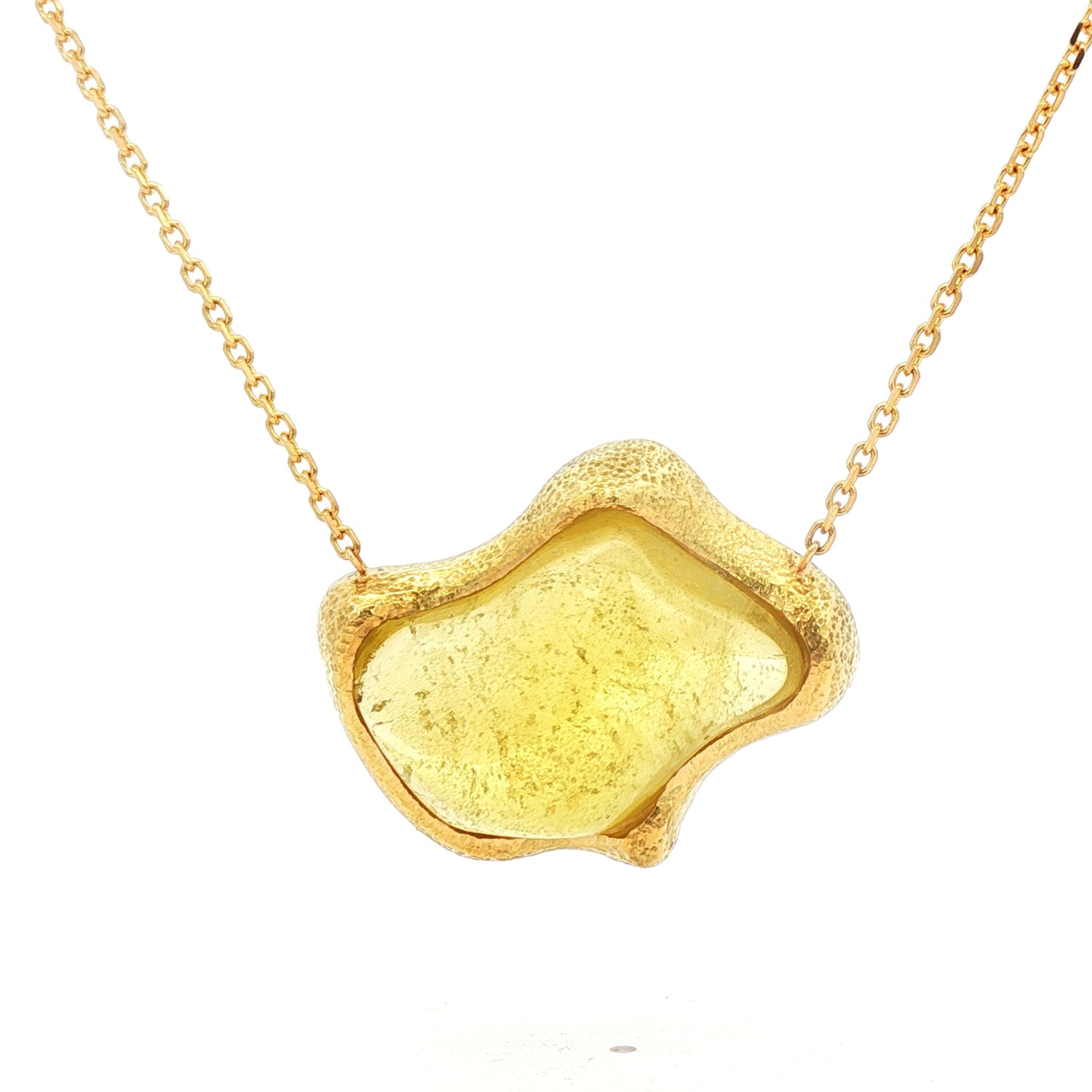 Bold jelly-style pendant featuring a 26.80ct freeform yellow beryl in a sculptural hammered 18K yellow gold setting, suspended on an adjustable 16–18 inch chain.