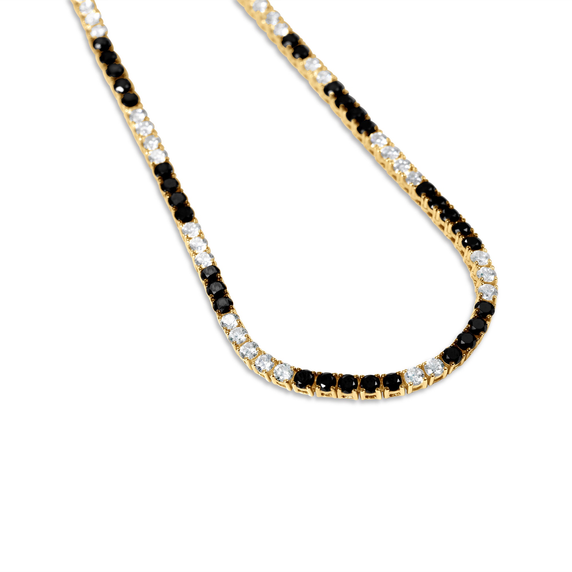 Striking tennis necklace crafted in 14K yellow gold, featuring alternating prong-set black and white diamonds, exuding bold sophistication and timeless charm. Close up image