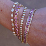 Stunning 14K yellow gold tennis bracelets featuring pink sapphires and  diamonds. 