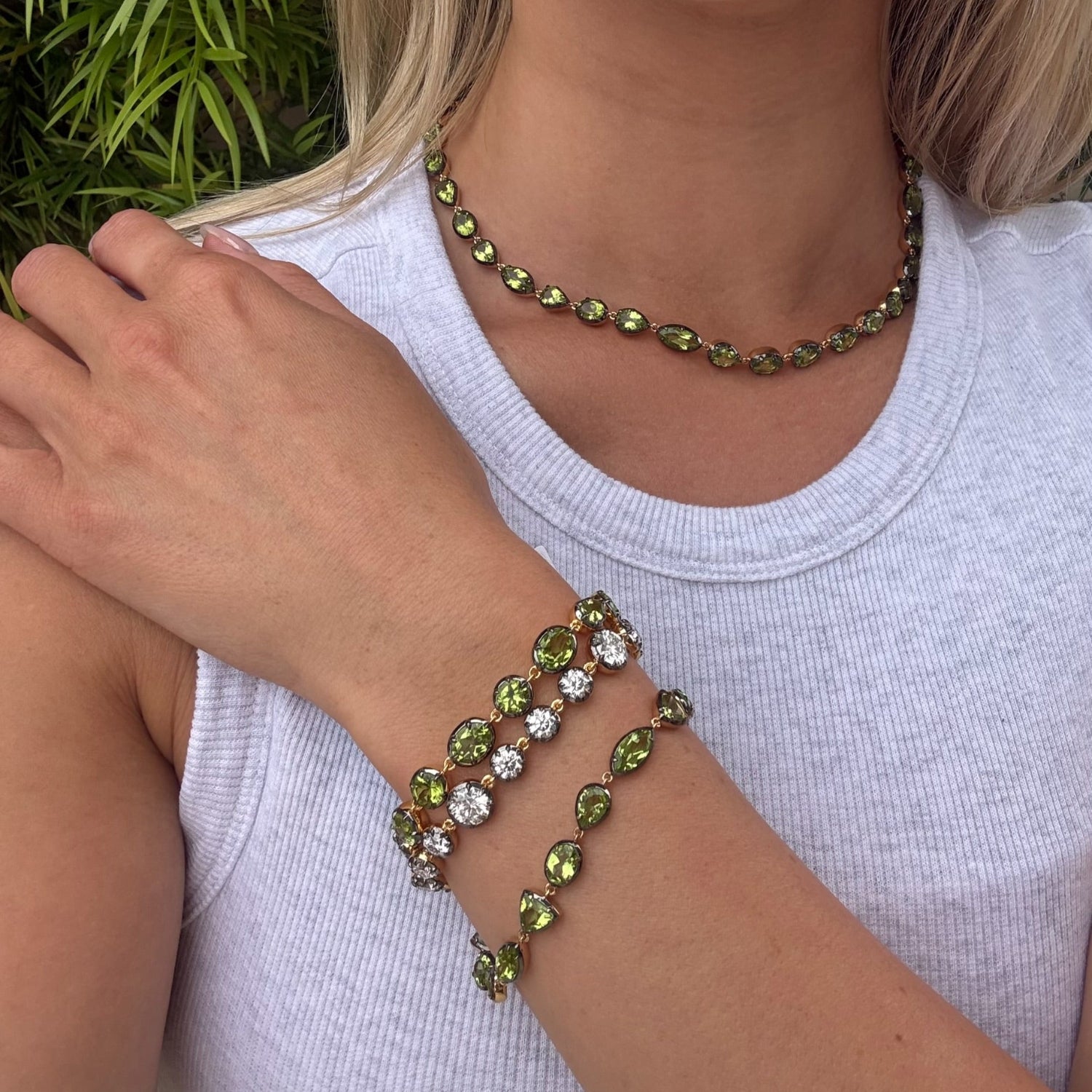 Elyzian Mixed shape peridot necklace, oval and round peridot bracelet, moissanite bracelet, and oval and pear cut bracelet. 