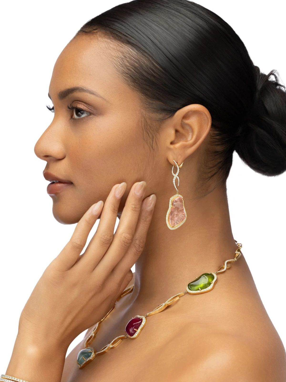 Model wearing Elyzian Chroma Forme gold necklace with colorful raw tourmaline gems and diamond accents, paired with matching drop earrings.