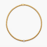Gold oval Paillette and Single Diamond Necklace. 