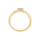 Stackable 14K yellow gold ring featuring a 0.29ct emerald cut diamond solitaire, with a sleek, minimalist profile measuring 3.1mm by 3.6mm and a total weight of 2.42g.