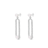Gracefully designed drop earrings in 18K white gold, featuring dazzling diamonds and luminous pearls, offering refined craftsmanship and timeless allure for special occasions. Side view.