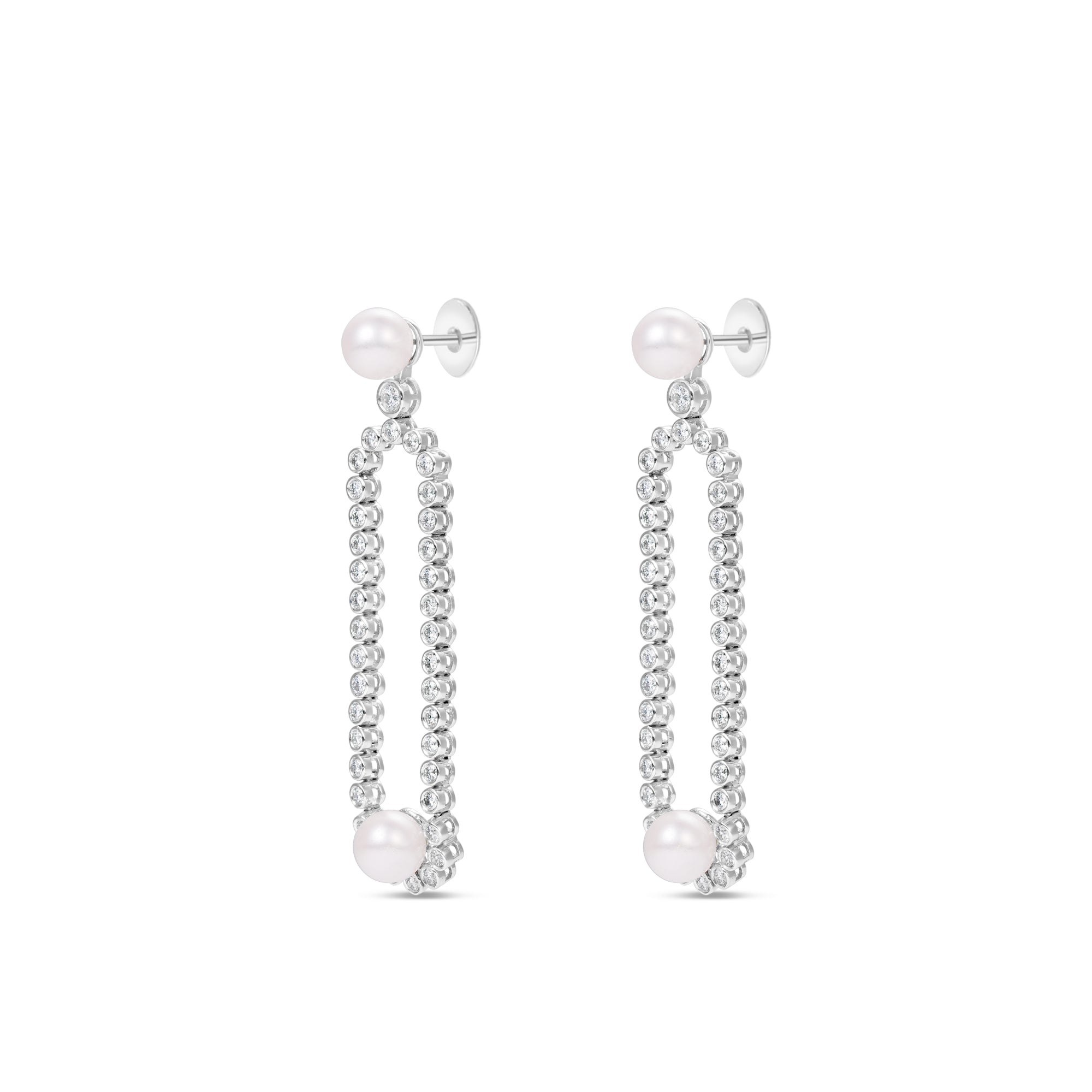 Gracefully designed drop earrings in 18K white gold, featuring dazzling diamonds and luminous pearls, offering refined craftsmanship and timeless allure for special occasions. Side view.