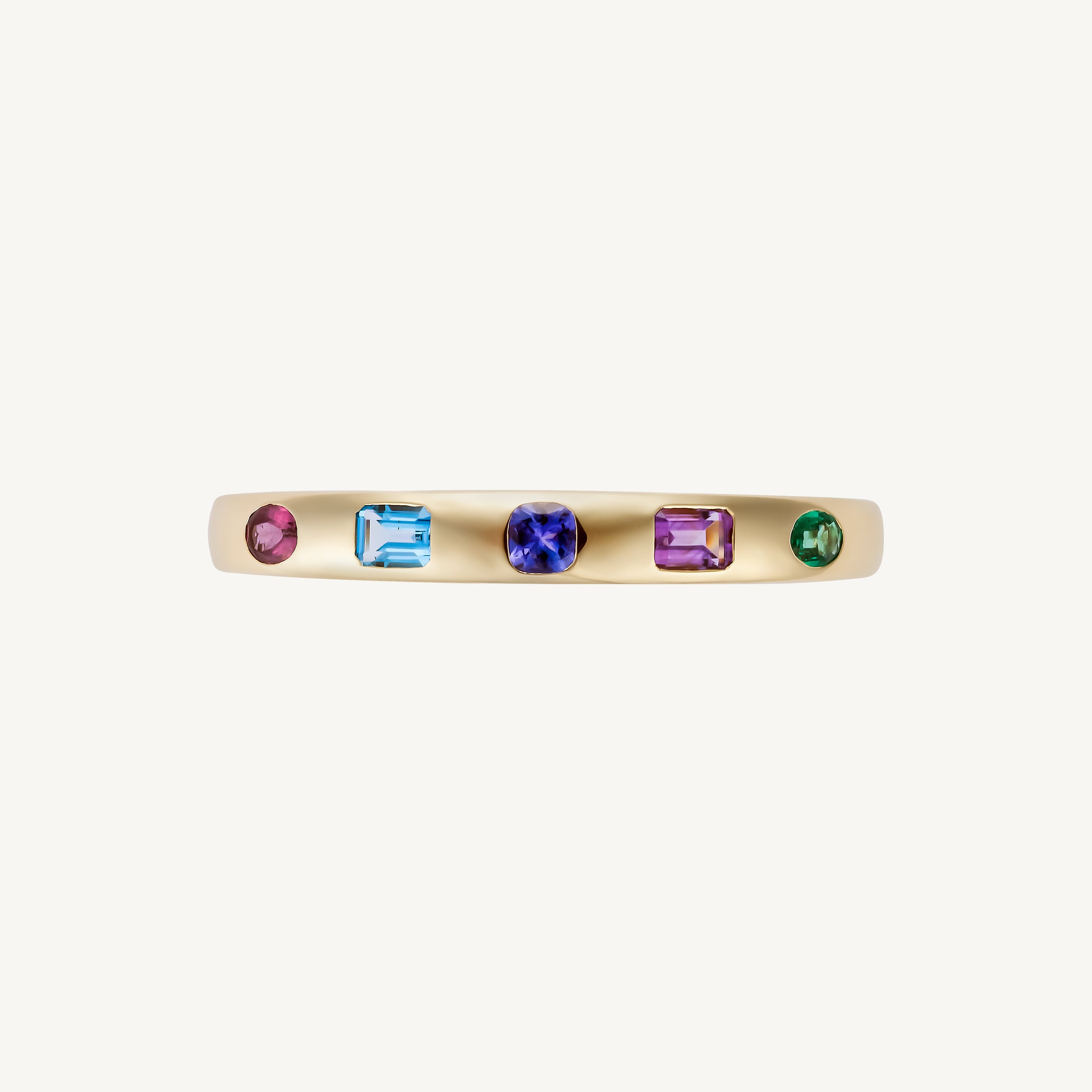 Side view of the original five-stone multicolor bangle in 14K yellow gold, showing the flush-set mixed-shape stones along the 21.71g cuff.