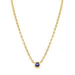 Sophisticated 14K yellow gold pendant necklace featuring a bezel-set blue sapphire centerpiece with sparkling diamonds along an adjustable mini rolo chain, offering timeless luxury and refined elegance.