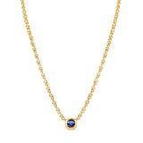 Sophisticated 14K yellow gold pendant necklace featuring a bezel-set blue sapphire centerpiece with sparkling diamonds along an adjustable mini rolo chain, offering timeless luxury and refined elegance.