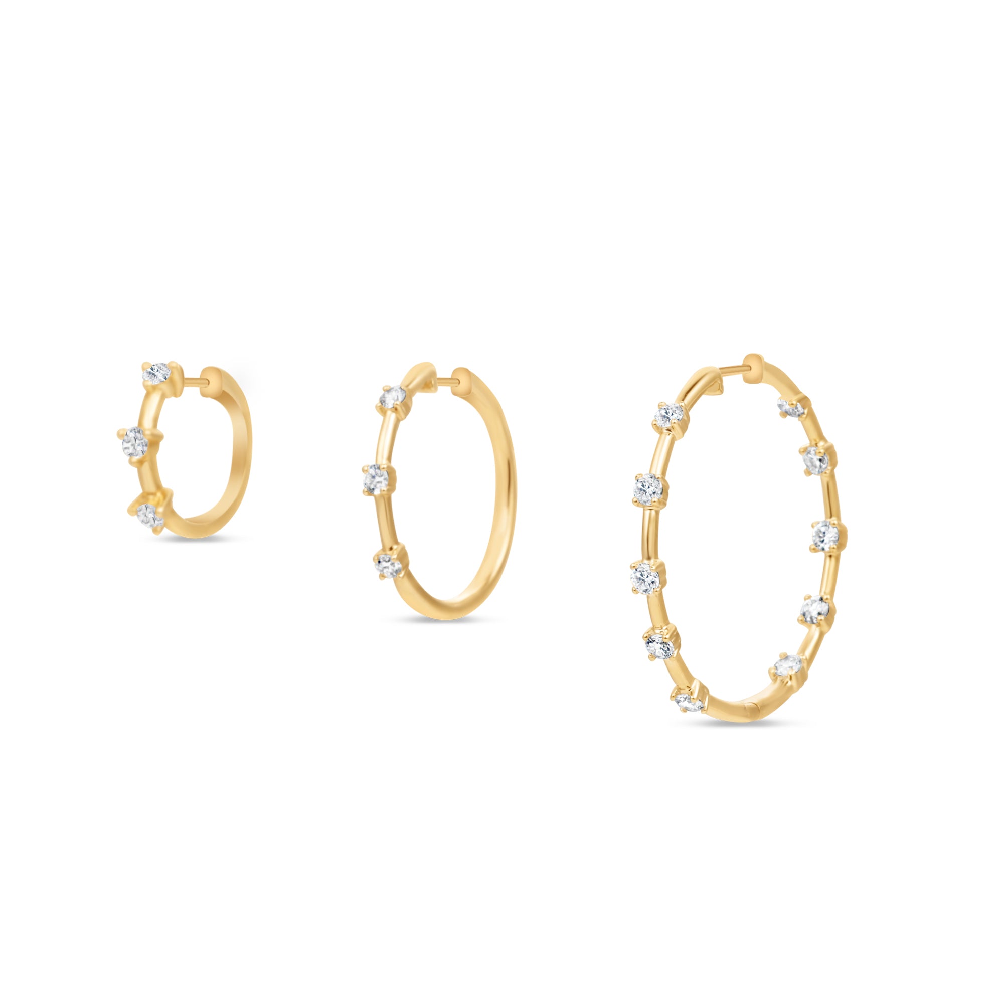 Trio of Elyzian Diamond Prong Set Huggie Hoop Earrings in 14K Yellow Gold shown side by side in graduated sizes