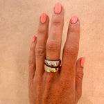 Dual-tone cigar band on a white background; both yellow and white gold have scattered natural diamonds.