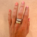 Dual-tone cigar band on a white background; both yellow and white gold have scattered natural diamonds.