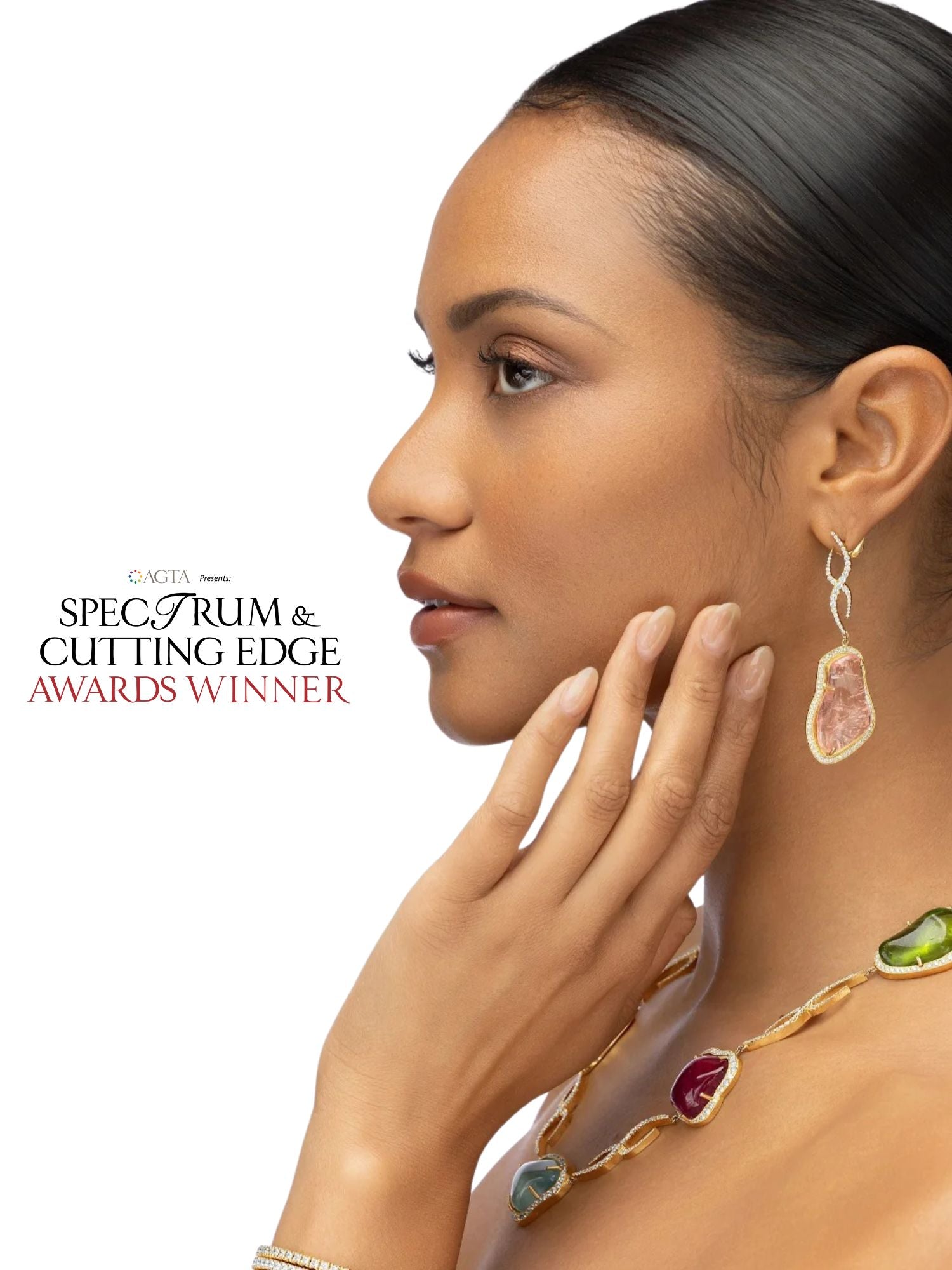 Woman wearing jewelry with a focus on an earring, set against a white background.