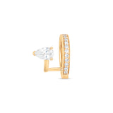 Gold ear cuff with a pear-shaped diamond on a white background