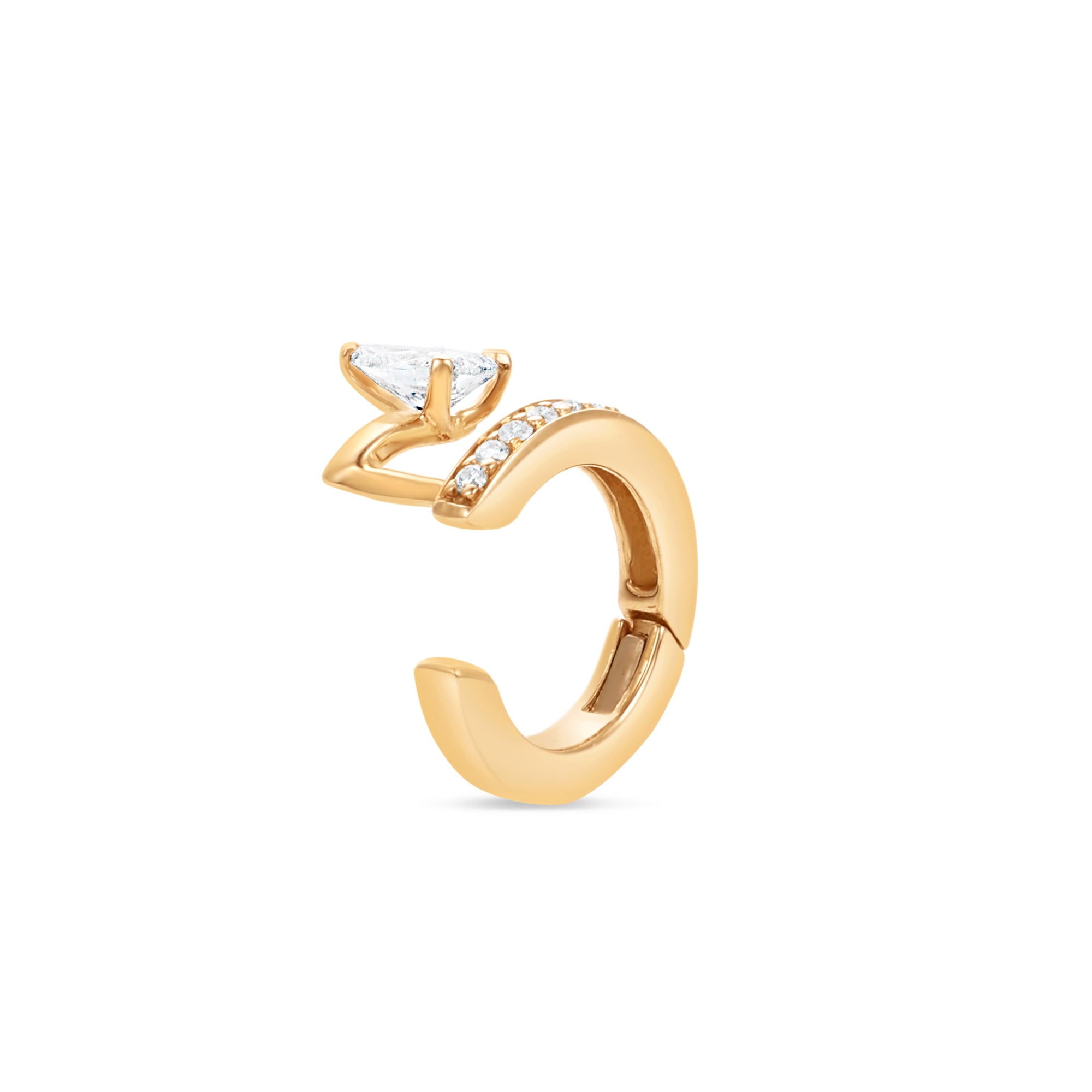 Gold ear cuff with a pear shape diamond accent on a white background
