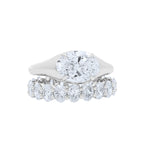 Lab grown oval diamond eternity band and oval east west engagement ring 