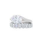 Lab grown oval diamond eternity band and oval east west engagement ring 