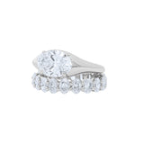 Lab grown oval diamond eternity band and oval east west engagement ring 