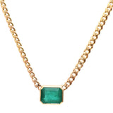 An emerald-cut emerald curb chain necklace in 14k yellow gold featuring a 5.14ct bezel-set emerald pendant (10mm x 12mm x 7mm) on a 17.5" curb chain.