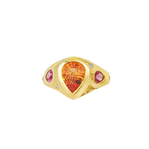 An 18k yellow gold bezel-set gemstone ring featuring a 1.89ct Fanta spessartite garnet, a 0.64ct pink spinel, and 0.15ct of natural diamonds.