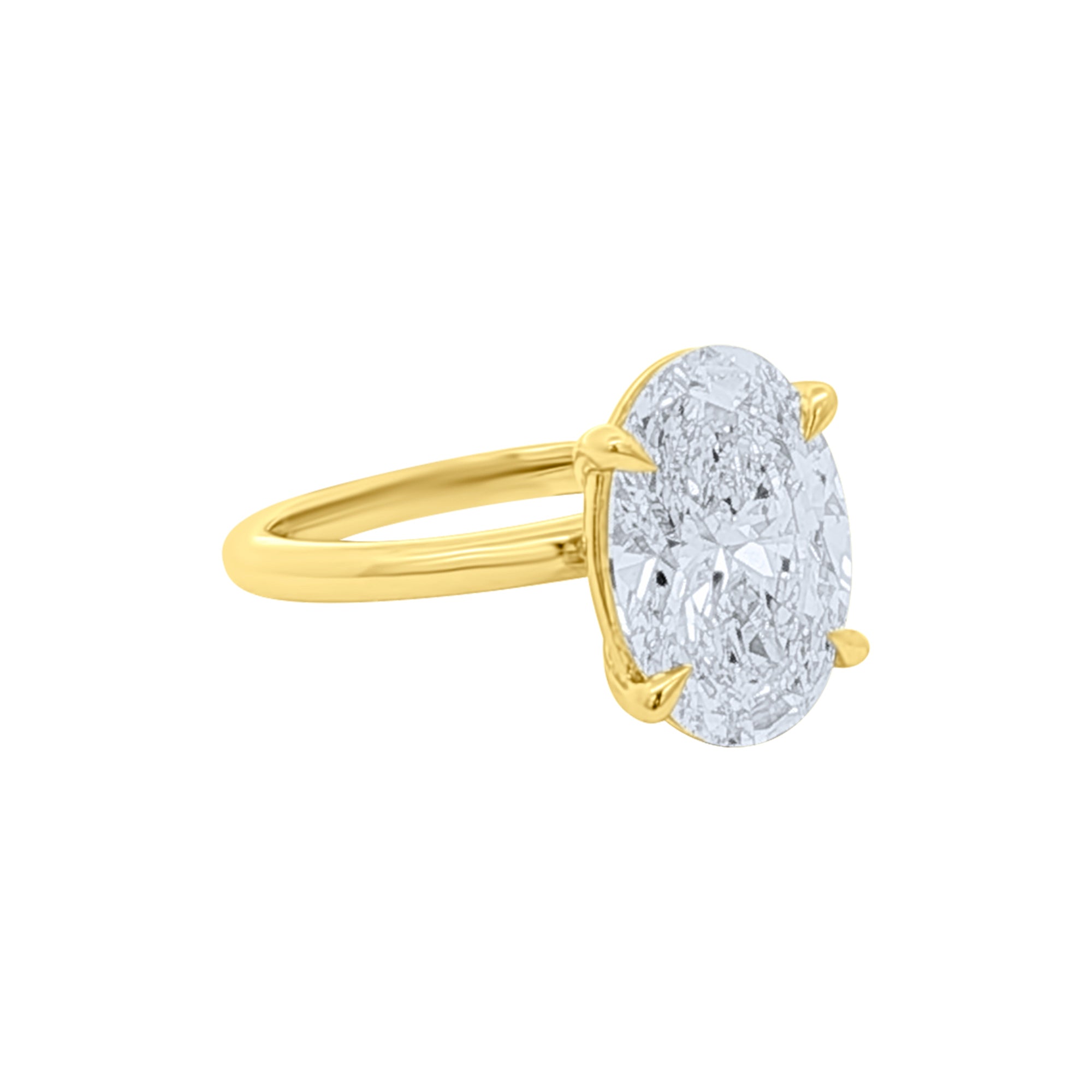 Side view of a Lab diamond 4ct oval solitaire engagement ring in 14k yellow gold by Elyzian Fine Jewelry