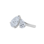 An angled view of a Lab grown diamond pear shaped toi et moi ring in 14k white gold by Elyzian Fine Jewelry