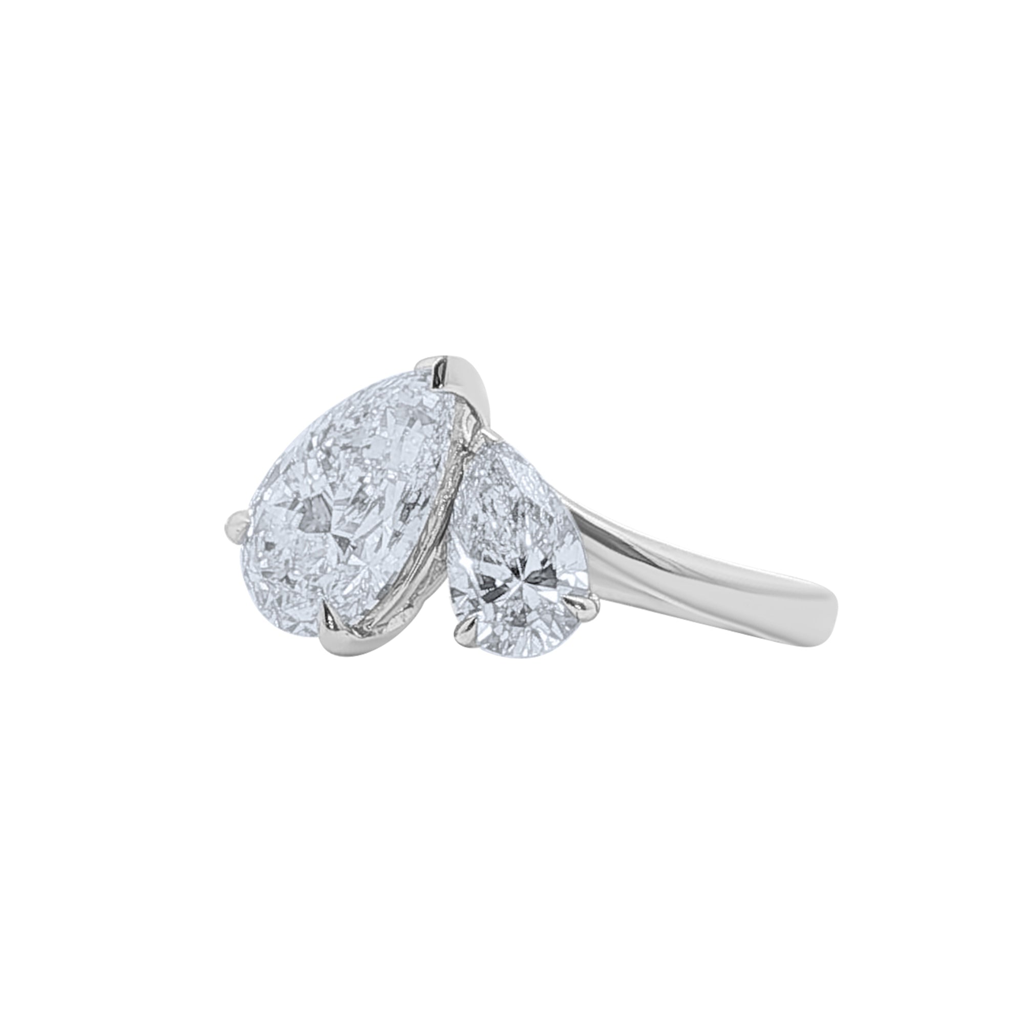 An angled view of a Lab grown diamond pear shaped toi et moi ring in 14k white gold by Elyzian Fine Jewelry