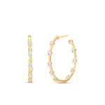 Side view of Large Diamond Prong Set Huggie Hoop Earrings in 14K Yellow Gold by Elyzian