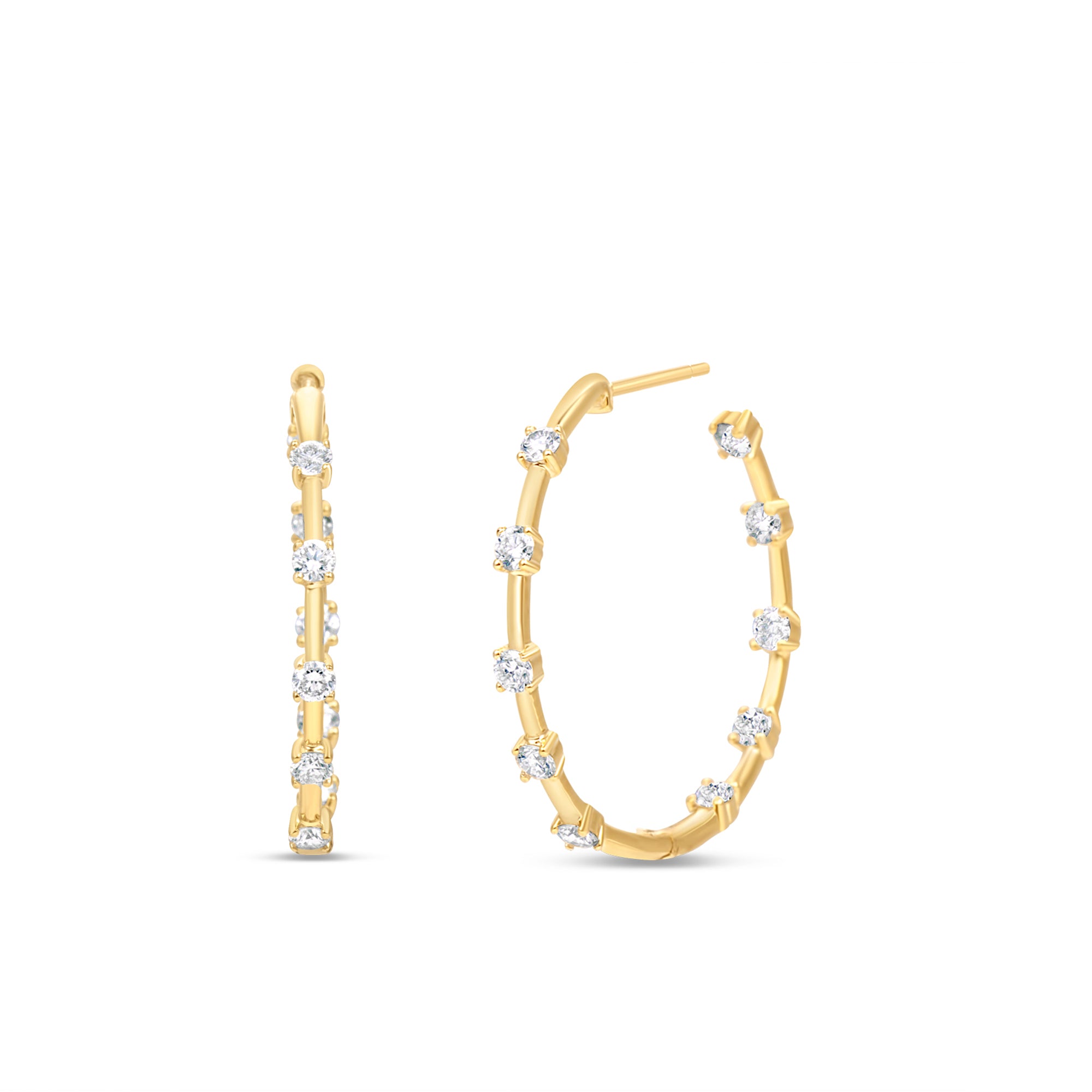 Side view of Large Diamond Prong Set Huggie Hoop Earrings in 14K Yellow Gold by Elyzian
