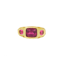 An 18k yellow gold bezel-set gemstone ring featuring a 0.78ct Mahenge spinel, a 3.75ct purple garnet, and 0.15ct of natural diamonds.