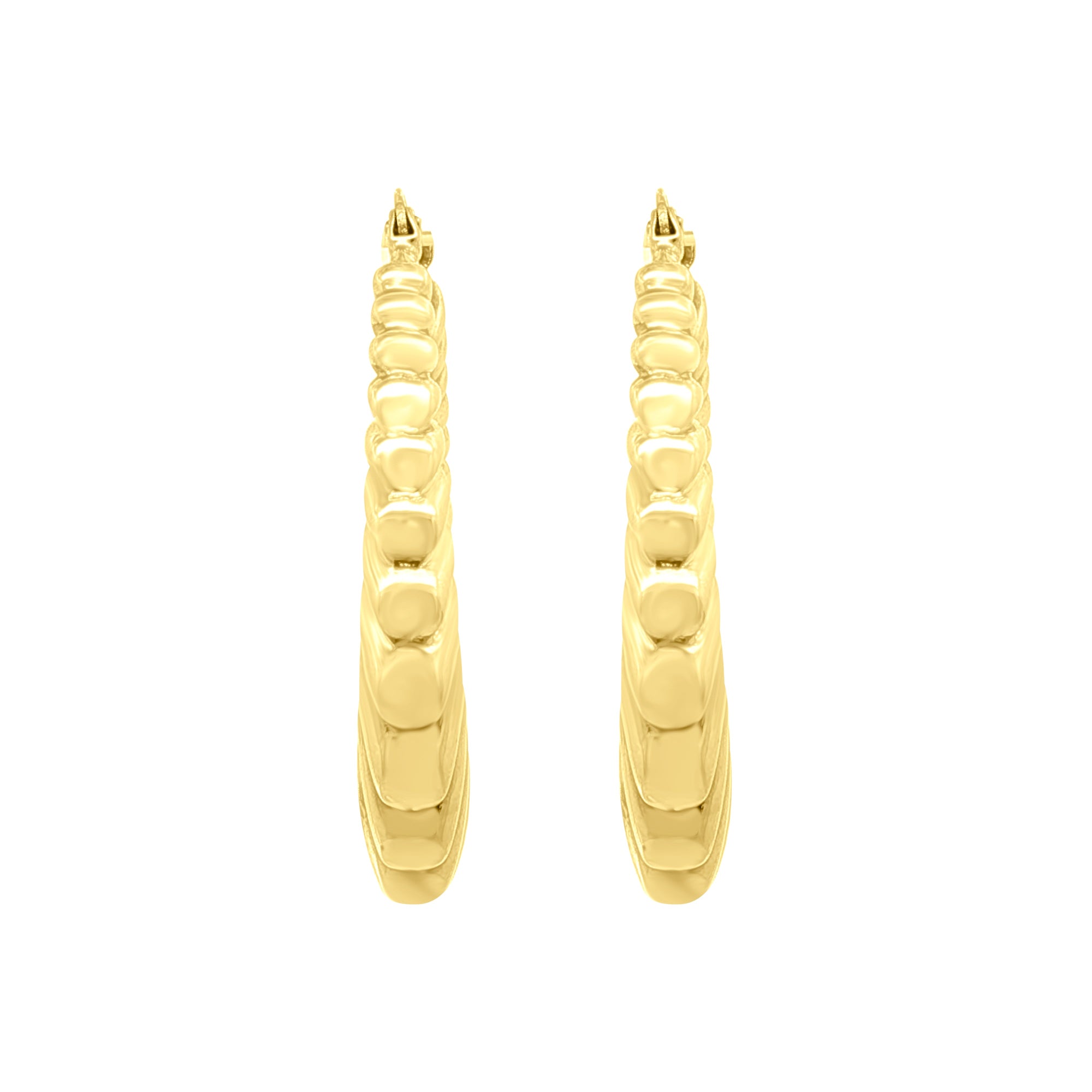 Side view of Medium Fluted Saddle Hoop Earrings in 14K Yellow Gold by Elyzian