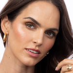 Elyzian 14k Yellow Goldmedium wave ridge hoop earrings. 