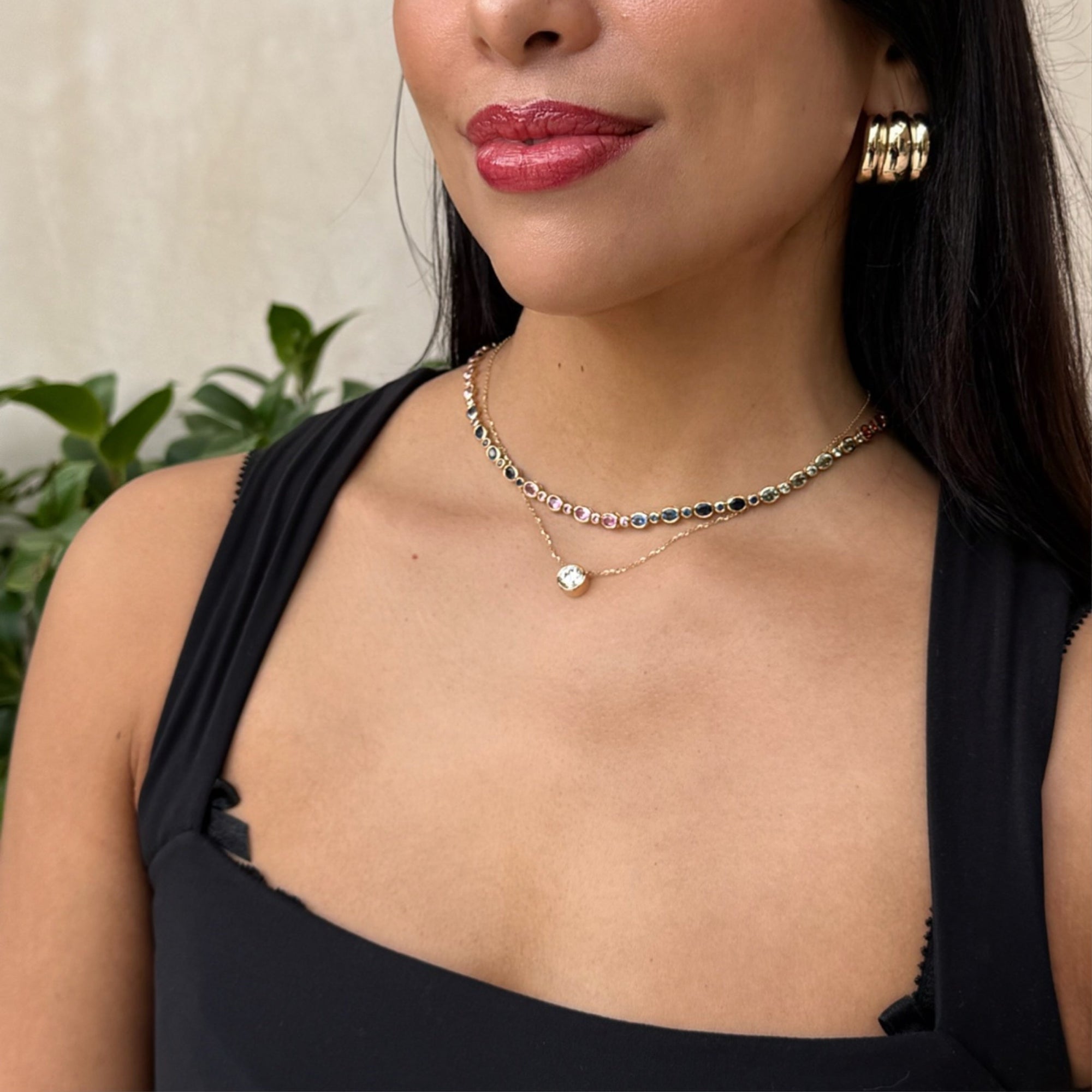 Modeled image of elyzian's round lab diamond pendant and oval cut multicolor sapphire tennis necklace
