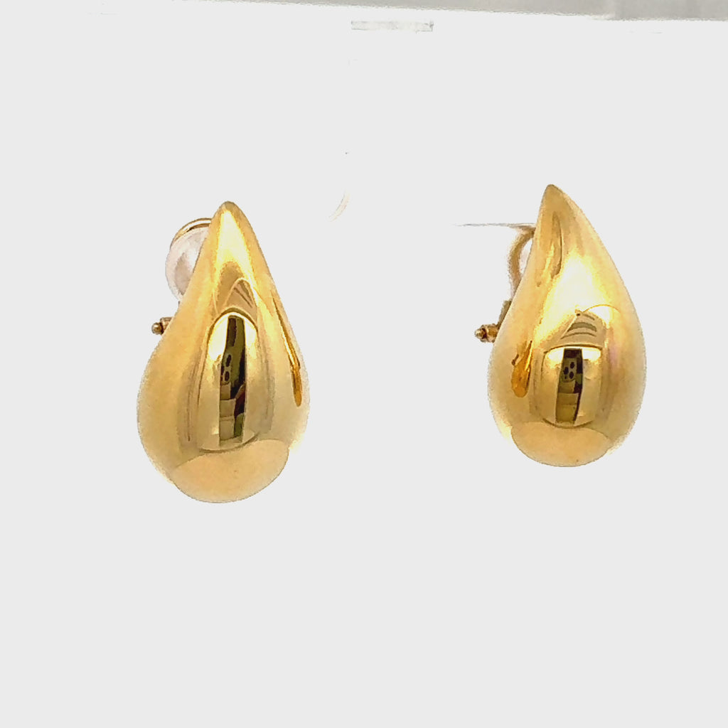 
Striking 14K yellow gold teardrop earrings with a bold, oversized silhouette, crafted in semi-hollow gold for a lightweight yet statement-making design. Video of earrings spinning to see all angles.
