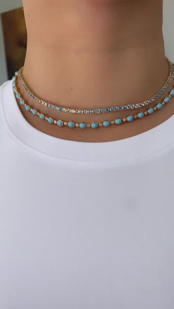 Striking 14K yellow gold necklace featuring 30.5ct of smooth cabochon turquoise and 4.45ct of round brilliant diamonds, with a total weight of 19.89g—a bold and vibrant statement piece.