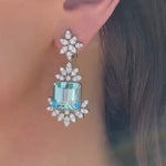 Video of Elyzian emerald-cut aquamarine and diamond drop earrings in 18K white gold.