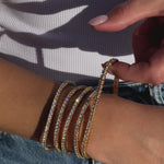 Luxurious stretch diamond tennis bracelet featuring G-H color, VS clarity diamonds in flexible settings. Available in multiple sizes, from 2.75ct to 9ct, for a perfect, comfortable fit with timeless brilliance. On model 