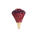 Side view of A 14k yellow gold dome ring featuring a 1.32ct rubellite center framed by 4.95ct of rhodolite and 2.84ct of amethyst in a pavé setting.