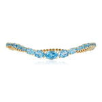 Swiss Blue Topaz wave cuff bangle in 14K yellow gold