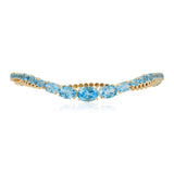 Swiss Blue Topaz wave cuff bangle in 14K yellow gold
